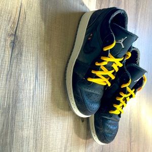 Boys Jordan’s youth size 3.5 mostly black with a pop of gray and yellow
